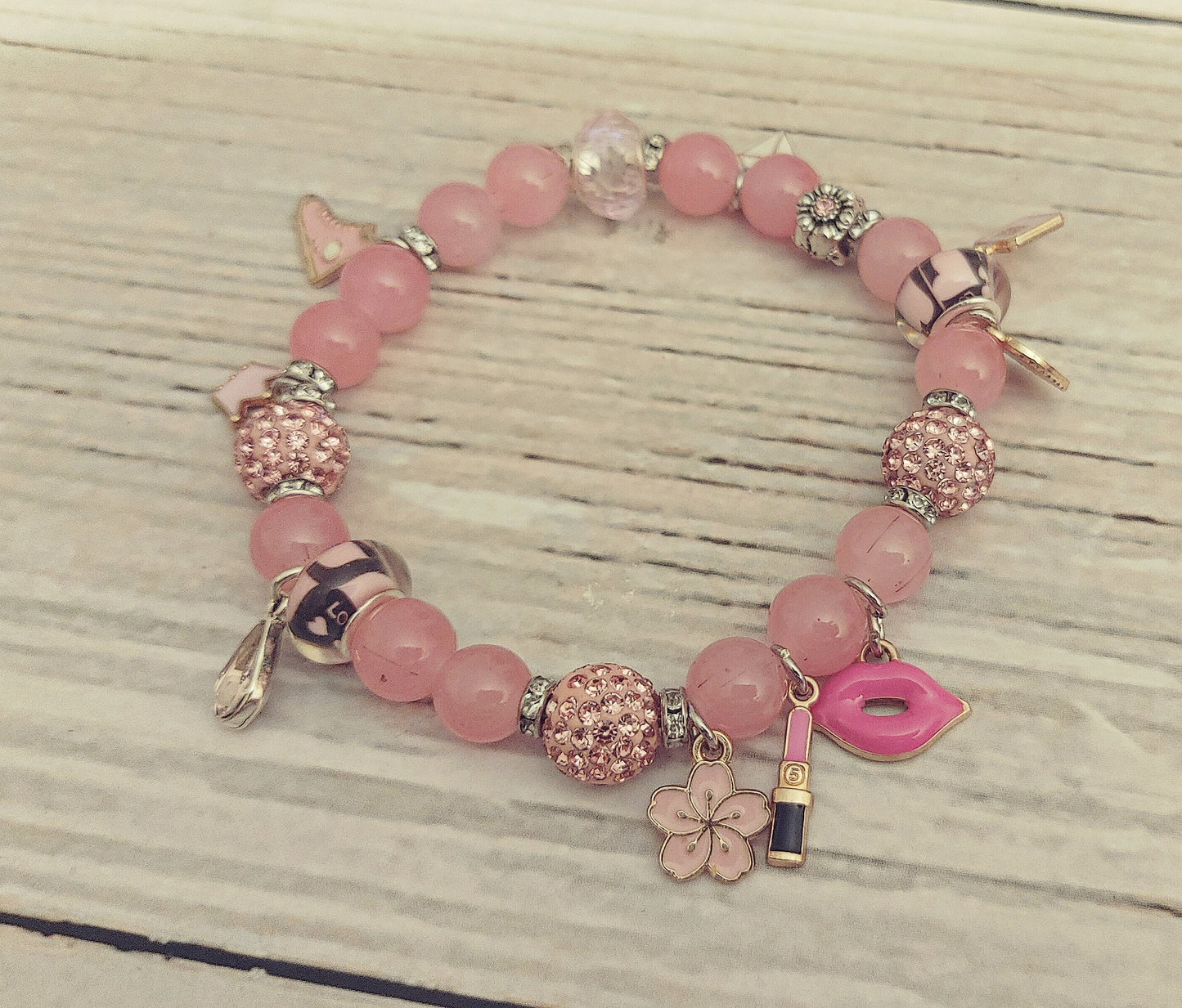 Pink bracelet with charms, 1 pc
